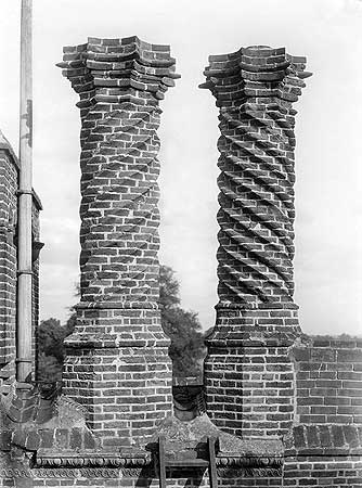 The fashion for chimneys in the Tudor period was for elaborate decoration using both cut and purpose-moulded brick. This example of spiral decoration at Layer Marney Hall is typical. 